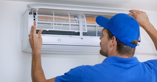 man working on hvac unit