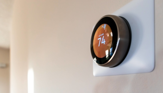close up image of smart thermostat at home